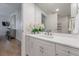 Elegant bathroom vanity with white cabinets and marble countertop at 450 Knights Run Ave # 415, Tampa, FL 33602