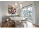 Bright dining area with a round table and access to a balcony at 450 Knights Run Ave # 415, Tampa, FL 33602