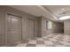 Elegant hallway with modern art and tiled flooring at 450 Knights Run Ave # 415, Tampa, FL 33602