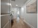 Bright hallway with hardwood floors and art accents at 450 Knights Run Ave # 415, Tampa, FL 33602