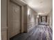 Building hallway with carpet and modern lighting at 450 Knights Run Ave # 415, Tampa, FL 33602