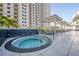 Relaxing hot tub with lounge chairs on a condo patio at 450 Knights Run Ave # 415, Tampa, FL 33602