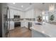 Bright kitchen featuring stainless steel appliances and marble countertops at 450 Knights Run Ave # 415, Tampa, FL 33602