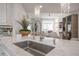 Modern kitchen with marble countertops and a farmhouse sink at 450 Knights Run Ave # 415, Tampa, FL 33602