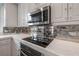 Modern kitchen with stainless steel appliances and marble countertops at 450 Knights Run Ave # 415, Tampa, FL 33602