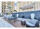 Relaxing patio with seating, water features, and modern building in the background at 450 Knights Run Ave # 415, Tampa, FL 33602