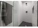 Shower stall with white subway tile and hexagon floor tile at 450 Knights Run Ave # 415, Tampa, FL 33602