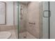 Modern shower with glass enclosure and neutral tile at 450 Knights Run Ave # 415, Tampa, FL 33602