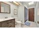 Bathroom with wood vanity and skylight at 4604 Westford Cir, Tampa, FL 33618