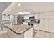 Spacious kitchen featuring an island, stainless steel appliances, and white cabinetry at 4604 Westford Cir, Tampa, FL 33618