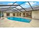 Relaxing pool with covered patio at 4604 Westford Cir, Tampa, FL 33618