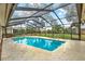 Inviting screened pool with a large patio at 4604 Westford Cir, Tampa, FL 33618