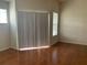 Living room with wood floors and sliding glass doors at 5125 Palm Springs Blvd # 10303, Tampa, FL 33647