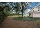 Backyard with a gravel path and mature trees at 5147 Sterling Manor Dr, Tampa, FL 33647