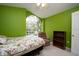 Bright bedroom with floral bedding, large window, and built-in shelving at 5147 Sterling Manor Dr, Tampa, FL 33647