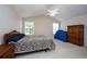 Spacious bedroom with vaulted ceiling, ceiling fan, and large windows at 5147 Sterling Manor Dr, Tampa, FL 33647