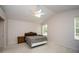 Bedroom with vaulted ceiling, ceiling fan, and window at 5147 Sterling Manor Dr, Tampa, FL 33647