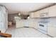 Galley kitchen with ample counter space and white cabinets at 5147 Sterling Manor Dr, Tampa, FL 33647