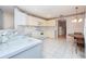 Bright kitchen with white appliances and tile floors at 5147 Sterling Manor Dr, Tampa, FL 33647