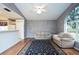 Living room with hardwood floors and a view to the kitchen at 5147 Sterling Manor Dr, Tampa, FL 33647