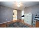 Home office with view into kitchen and hardwood floors at 5147 Sterling Manor Dr, Tampa, FL 33647