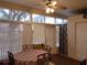 Casual dining area with table and chairs, adjacent to sliding doors at 5745 40Th N Ave # 152B, St Petersburg, FL 33709