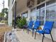 Relaxing patio with blue chairs, perfect for enjoying the Florida sunshine at 5745 40Th N Ave # 152B, St Petersburg, FL 33709