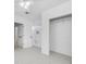 Bright bedroom featuring a spacious closet and tile floors at 5810 Town N Country Blvd, Tampa, FL 33615