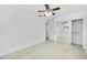 Well lit bedroom with mirrored closet and ceiling fan at 5810 Town N Country Blvd, Tampa, FL 33615