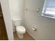 Clean bathroom with toilet and wall-mounted fixtures at 6802 Seaview Way, Tampa, FL 33615