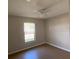 Bright bedroom with a large window and ceiling fan at 6802 Seaview Way, Tampa, FL 33615