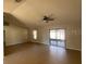 Bright living room with neutral walls and ceiling fan at 6802 Seaview Way, Tampa, FL 33615