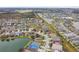 Aerial view of community near lake and houses at 6944 Runner Oak Dr, Wesley Chapel, FL 33545