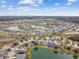 Aerial view of a large community with houses and lakes at 6944 Runner Oak Dr, Wesley Chapel, FL 33545