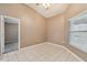 Bright bedroom with tile floors and a window with blinds at 6944 Runner Oak Dr, Wesley Chapel, FL 33545