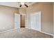 Bedroom with double door closet and carpet flooring at 6944 Runner Oak Dr, Wesley Chapel, FL 33545