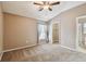 Bedroom with window, closet, and ceiling fan at 6944 Runner Oak Dr, Wesley Chapel, FL 33545