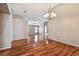 Hardwood floor dining room with view to living room at 6944 Runner Oak Dr, Wesley Chapel, FL 33545