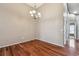 Dining room with hardwood floors and chandelier at 6944 Runner Oak Dr, Wesley Chapel, FL 33545