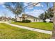 House exterior showcasing a stone facade and landscaping at 6944 Runner Oak Dr, Wesley Chapel, FL 33545