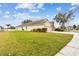 Side view of the house showcasing its size and curb appeal at 6944 Runner Oak Dr, Wesley Chapel, FL 33545