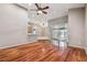 Bright and airy living room with hardwood floors and sliding doors at 6944 Runner Oak Dr, Wesley Chapel, FL 33545