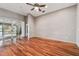 Living room with hardwood floors and sliding doors at 6944 Runner Oak Dr, Wesley Chapel, FL 33545