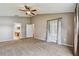 Main bedroom with carpet, ceiling fan, and access to bathroom at 6944 Runner Oak Dr, Wesley Chapel, FL 33545