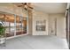 Covered patio with sliding glass doors and water view at 6944 Runner Oak Dr, Wesley Chapel, FL 33545