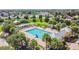 Community swimming pool with plenty of space for lounging at 6944 Runner Oak Dr, Wesley Chapel, FL 33545