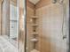 Shower with multiple shelves for toiletries at 6944 Runner Oak Dr, Wesley Chapel, FL 33545