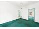 Living room with green carpet and a chandelier at 710 Seminole St, Clearwater, FL 33755