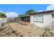 Backyard with screened porch and chain link fence at 7310 Oakshire Dr, Port Richey, FL 34668