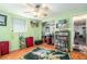 Bedroom with hardwood floors, ceiling fan, and bookcase at 7310 Oakshire Dr, Port Richey, FL 34668